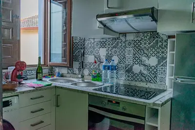 a kitchen with a sink and a counter top at Casa en zona medieval in Monforte de Lemos