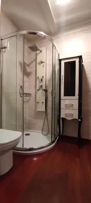 a bathroom with a shower and a toilet and a sink at Apartamentos Turísticos Betanzos in Betanzos