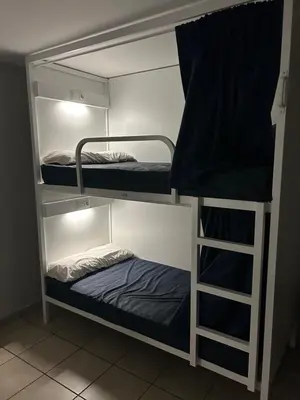 a bunk bed with two bunk beds in a room at Albergue San Anton in Melide