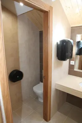 a bathroom with a toilet and a sink at Albergue San Anton in Melide
