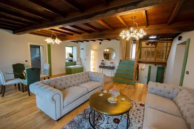 a living room with a couch and a table at CASA CON ENCANTO (o Refuxio) in Merza