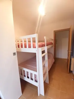 a bedroom with two bunk beds in a room at Indiano 5B in Viveiro