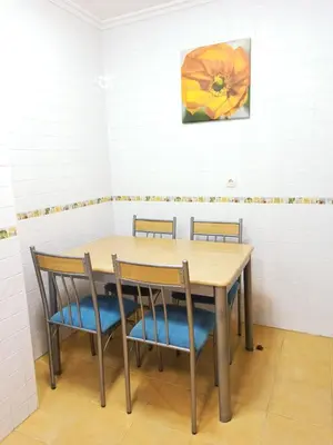 a table and chairs in a room at Indiano 5B in Viveiro