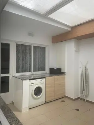 a laundry room with a washing machine in it at ARZUAWAY in Arzúa
