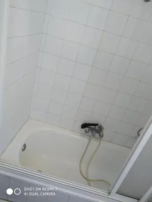 a bath tub with a faucet in a bathroom at Hostal padornelo in Mondoñedo