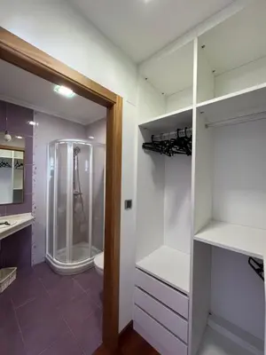 a bathroom with a walk in shower and a toilet at Apartamento Vila O Valadouro 2 in O Valadouro