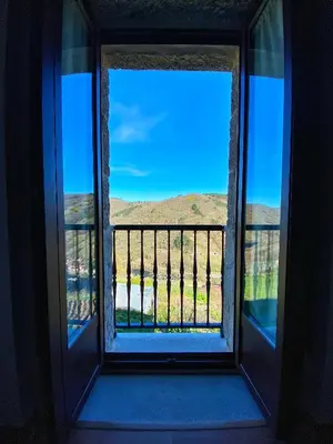 an open window with a view of a mountain view at Casa do Veiga in Chantada