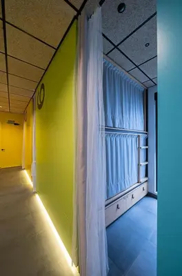 a room with a white curtain and a window at Dpaso hostel in Chantada