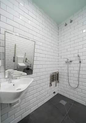 a white bathroom with a sink and a mirror at Dpaso hostel in Chantada