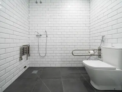 a white bathroom with a shower and a toilet at Dpaso hostel in Chantada