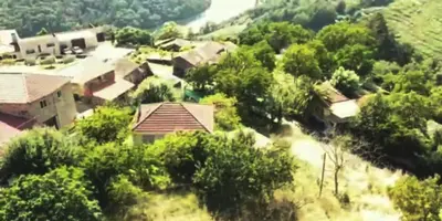 an aerial view of a house in a village at Casa Loureira - Ribeira Sacra in Rosende