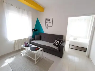 a living room with a couch and a table at XOXO - Arco in Ponferrada