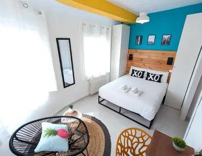 a small room with a bed and a table at XOXO - Arco in Ponferrada