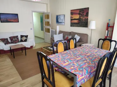 a living room with a table and a couch at La Puebla in Ponferrada