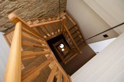 an overhead view of a wooden staircase in a house at The Tailor's Garden in Santiago de Compostela