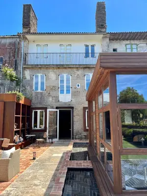 an external view of a house with a patio at The Tailor's Garden in Santiago de Compostela