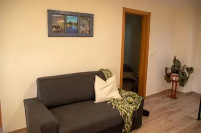 a living room with a couch with a pillow on it at Casa Galegos in Pantón