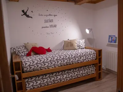 a bedroom with a bed with a sign on the wall at Casa Galegos in Pantón