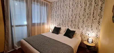 a bedroom with a bed and a window at Apartamento Inma in Silleda