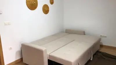 a small room with a bed in a room at O Pequeno Rincón in Allariz