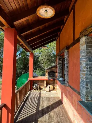 an outside view of a porch of a house at A Porteliña Casa Rural, entre viñedos y castaños in Ambas Aguas