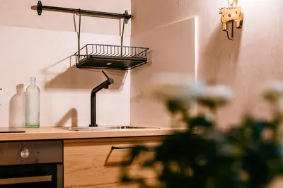 a kitchen with a sink and a counter top at Apartamento turístico rural Casa Chaín in Lugo