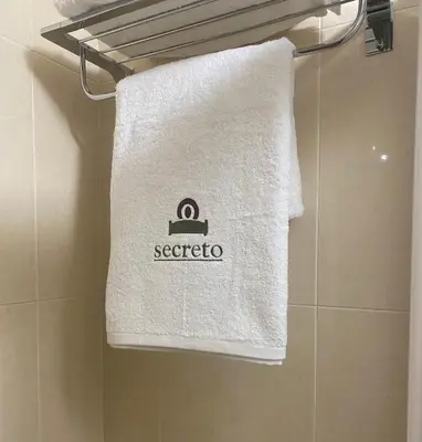 a towel hanging on a towel rack in a bathroom at O SECRETO in Padrón