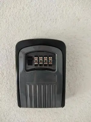 a black object is attached to a wall at A Chamiseiriña in Padrón