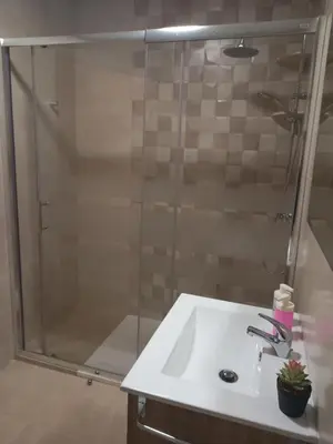 a bathroom with a sink and a shower at Hotel La Puerta de Arzúa in Arzúa