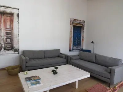 a living room with two couches and a coffee table at APARTAMENTOS ARMANYA 3 in Lugo