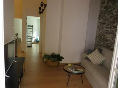 a living room with a couch and a table at APARTAMENTOS ARMANYA 3 in Lugo