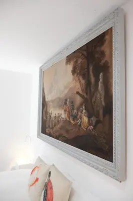 a painting hanging on a wall in a room at Lujoso y amplio piso con 5 habitaciones in Santiago de Compostela
