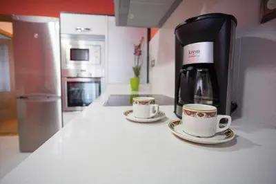 two cups of coffee on a counter in a kitchen at Casa Goros in Melide