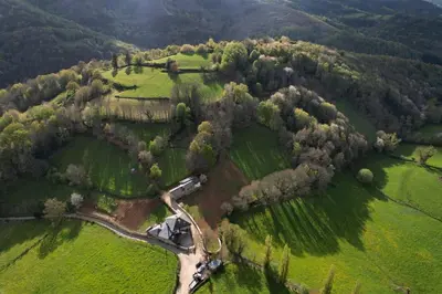 an aerial view of a field with trees and a road at Casas Eladio-Doncos in Torés