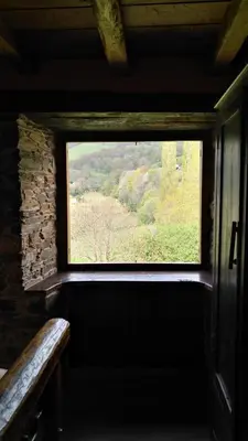 a window in a room with a view of a field at Casas Eladio-Doncos in Torés