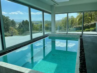 a swimming pool with a view of the mountains at Tres Prismas Exclusive in Sarria