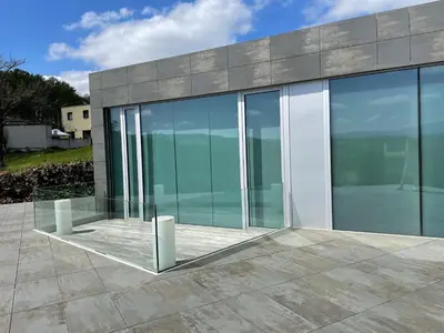 a glass house with a view of the ocean at Tres Prismas Exclusive in Sarria