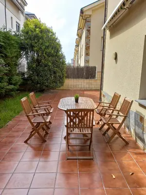 a patio with a table and chairs on a patio at Tapia in Tapia de Casariego