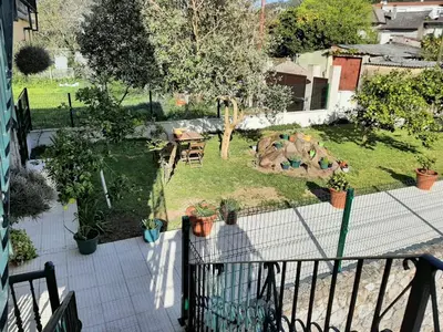 an aerial view of a backyard with a playground at Apartamento AS CARBALLAS in Caldas de Reis