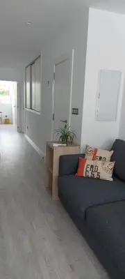 a living room with a couch and a table at Avante24 in Puentedeume