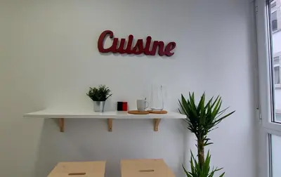a white shelf on a wall with aulum sign on it at Avante24 in Puentedeume