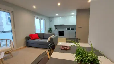 a living room with a couch and a table at Avante24 in Puentedeume