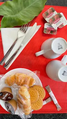 a plate of food with eggs and crackers on a table at Alfonso Vll in Caldas de Reis