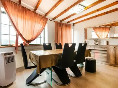 a dining room with a table and chairs at Apartment near Santiago de Compostela in Eirapedriña