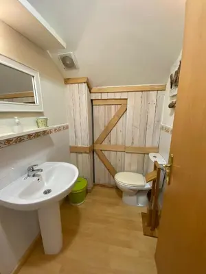a bathroom with a sink and a toilet at Casa Loureal Ribeira Sacra Ourense in Ourense