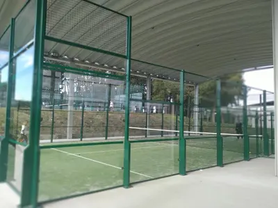 a tennis court with a net on a court at Casa Loureal Ribeira Sacra Ourense in Ourense