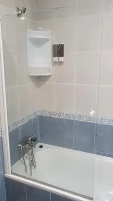 a bathroom with a shower with a bath tub at Os Castelos Playa de Covas in Viveiro