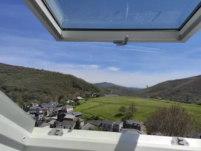 a view from the window of a house with mountains at CASA RURAL PAJARICA en Sanabria in San Ciprián