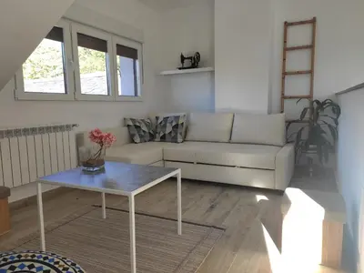 a living room with a couch and a table at CASA RURAL PAJARICA en Sanabria in San Ciprián
