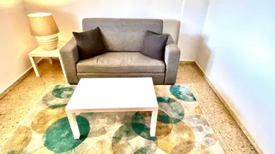 a living room with a couch and a coffee table at Apartamento Padrón Centro P3 by URent in Padrón